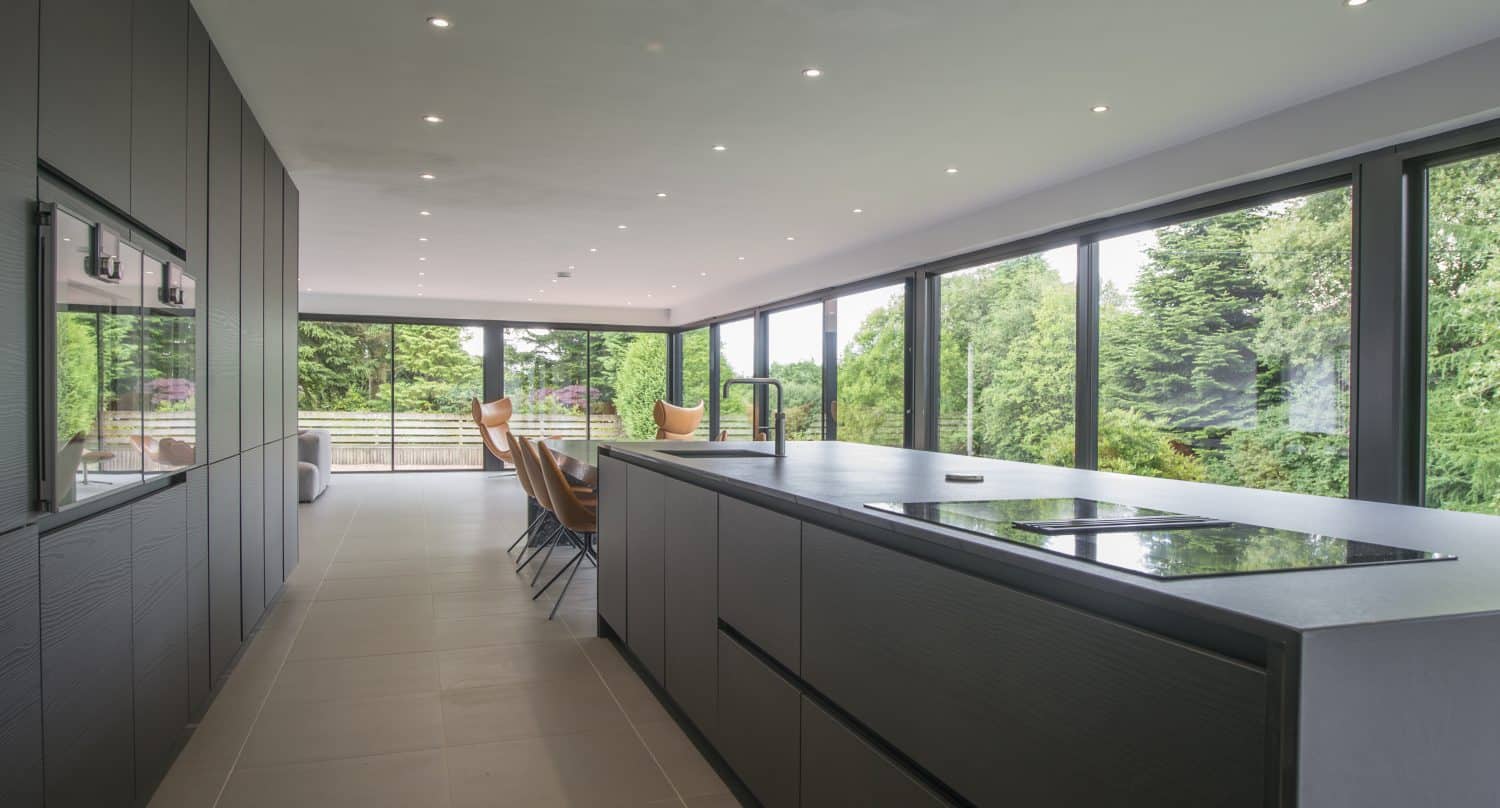large panoramic glass sliding doors from kitchen