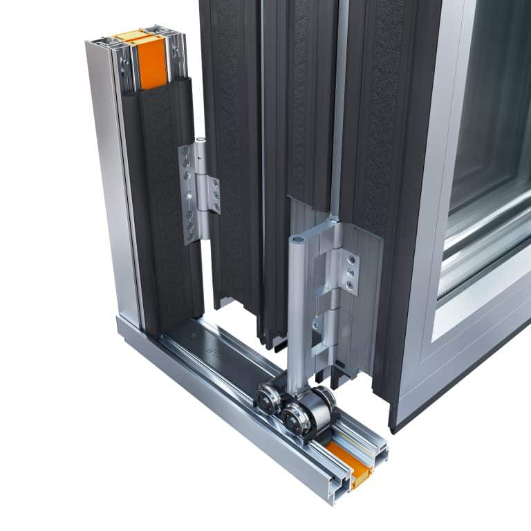 Close-up of an aluminum sliding door system showing the frame, roller mechanism, and sliding track with orange components—highlighting the construction and hardware details ideal for bespoke glass solutions and modern sliding doors.