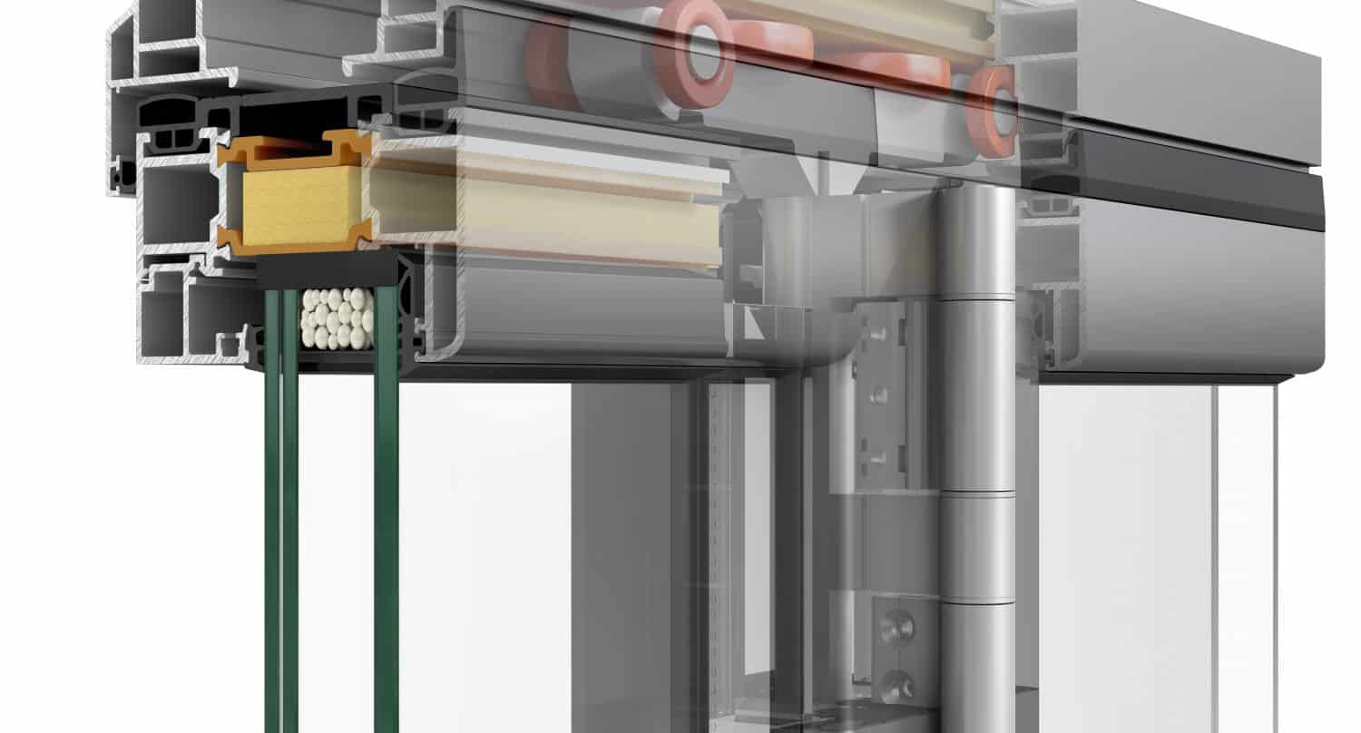 A detailed cross-section of an aluminum frame for sliding doors, showing insulation materials, glass panes, internal rollers, and structural components for the sliding mechanism.