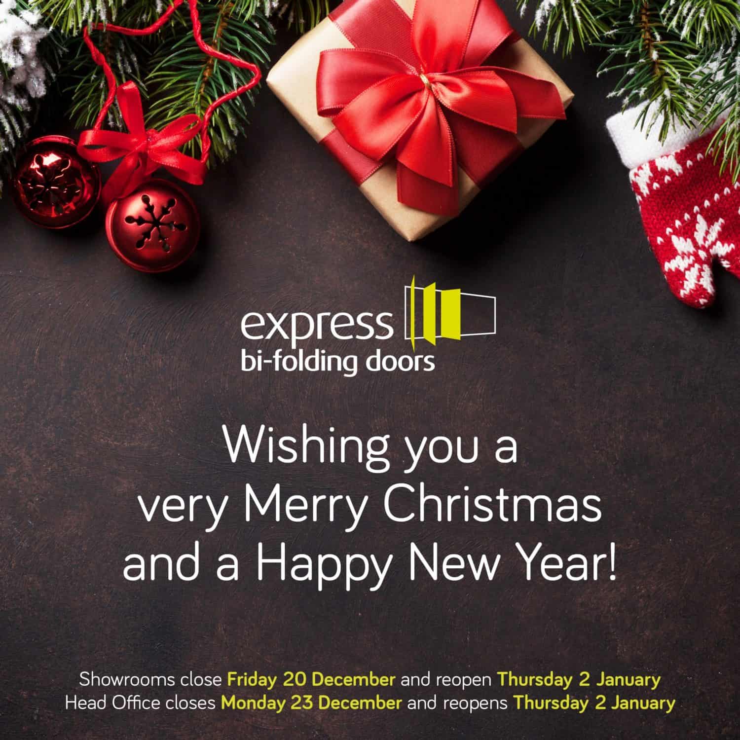 A festive holiday card with a wrapped gift, red bow, pine branches, and ornaments. Text reads: Wishing you a very Merry Christmas and a Happy New Year! Plus closure dates for Express Bi-Folding Doors—your home for bespoke glass solutions.