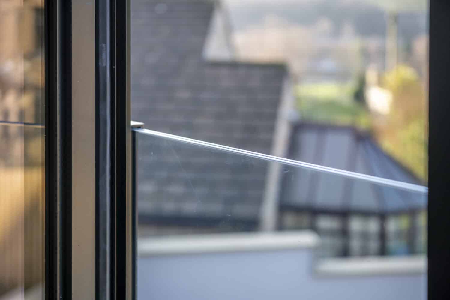 Close view of a frameless juliet balcony