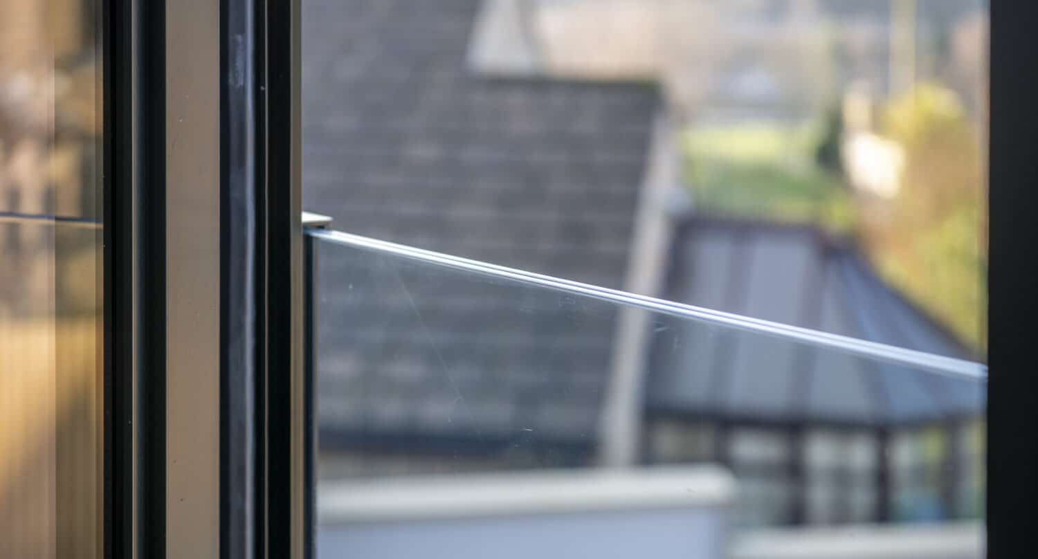 Close view of a frameless juliet balcony