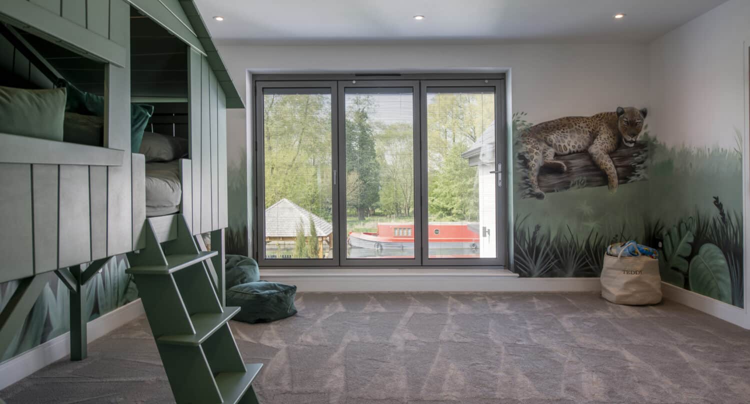 Jungle-themed children's playroom with custom aluminium bi folding windows