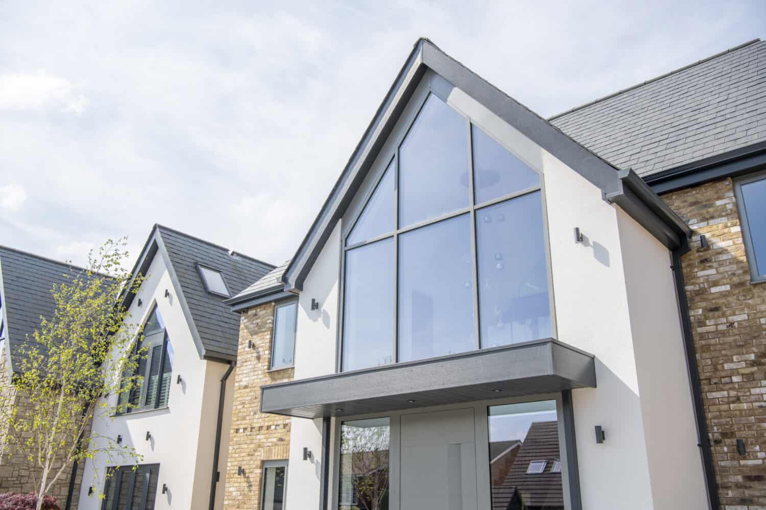 Aluminium glass curtain walling paired with a triangular roof design