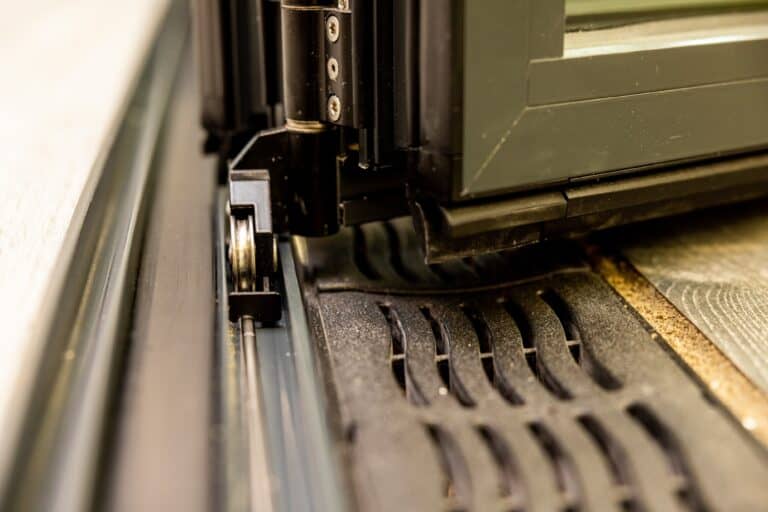 Aluminium bifold door roller system