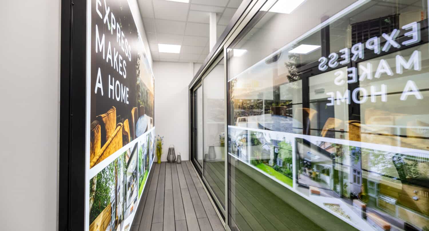 Three panel black sliding doors in a showroom