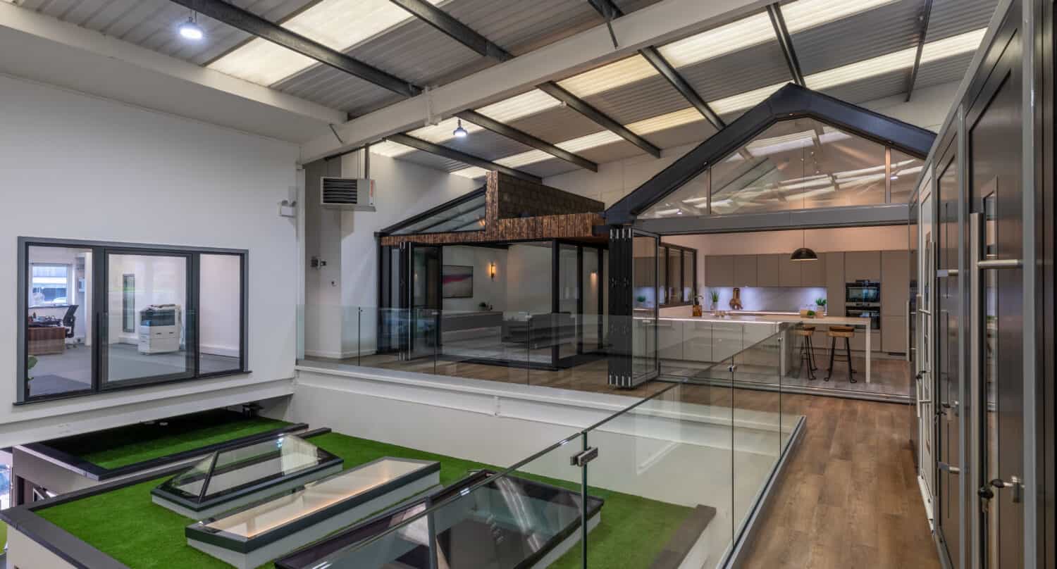 Windows and bi folding doors showroom featuring different living spaces