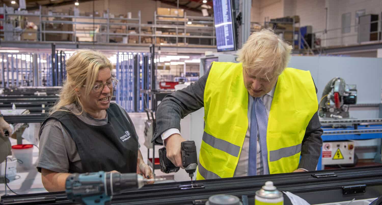 Boris Johnson and a windows technician working on a bifold door