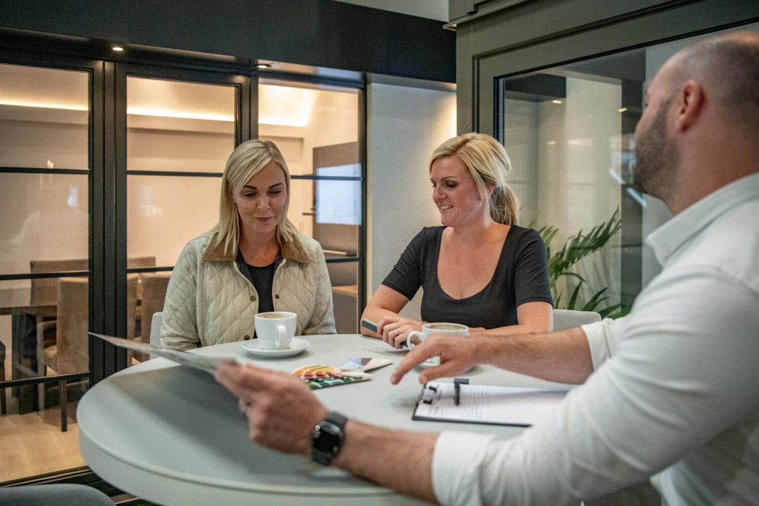 Two ladies discussing their design renovation options with an Express Bi folds Team Member