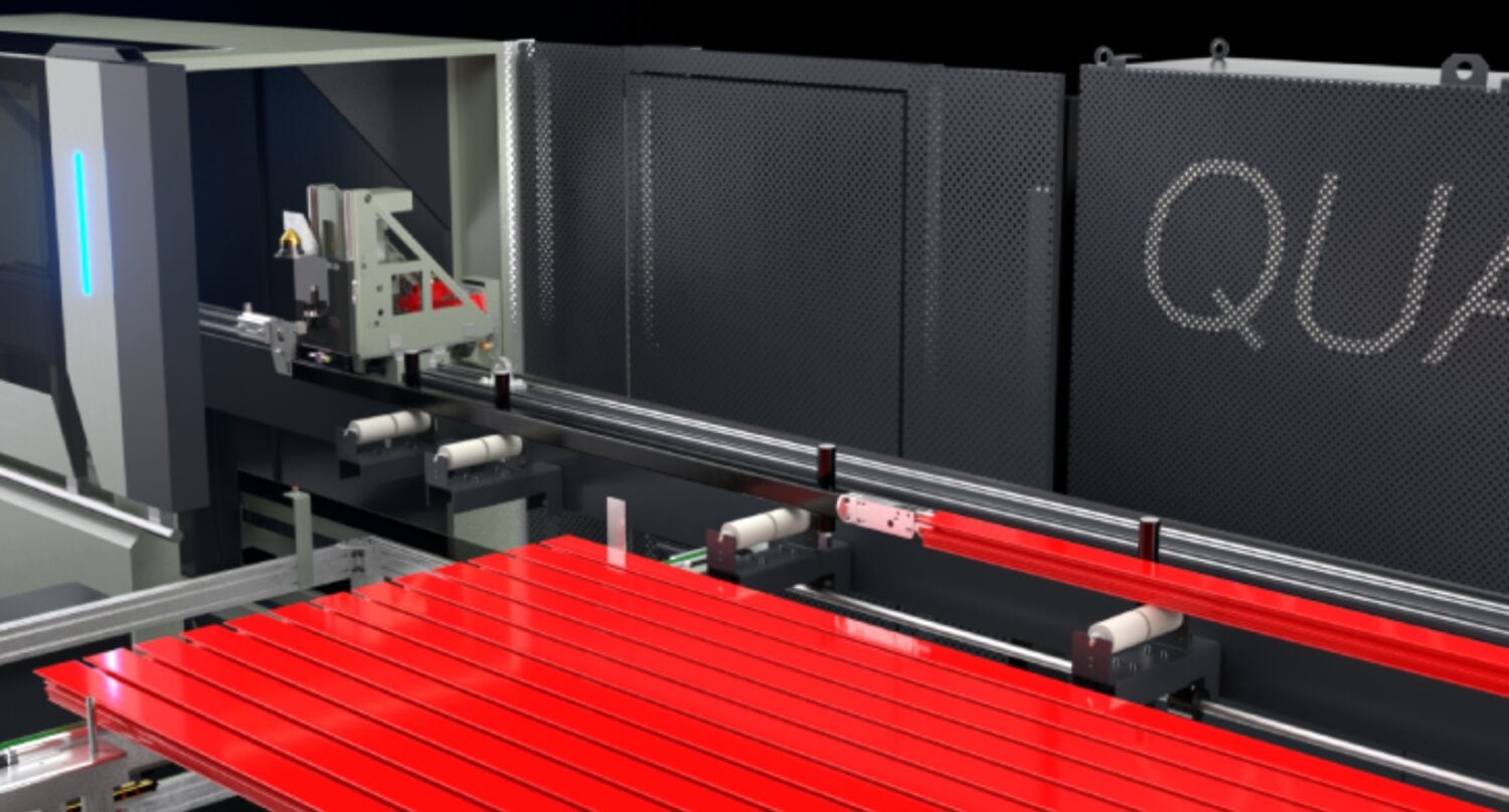A modern industrial machine with a row of bright red panels on a conveyor system, metal rollers, and a dark exterior featuring the partial word QUA. It appears high-tech and is designed for crafting bespoke glass solutions like bifold doors.