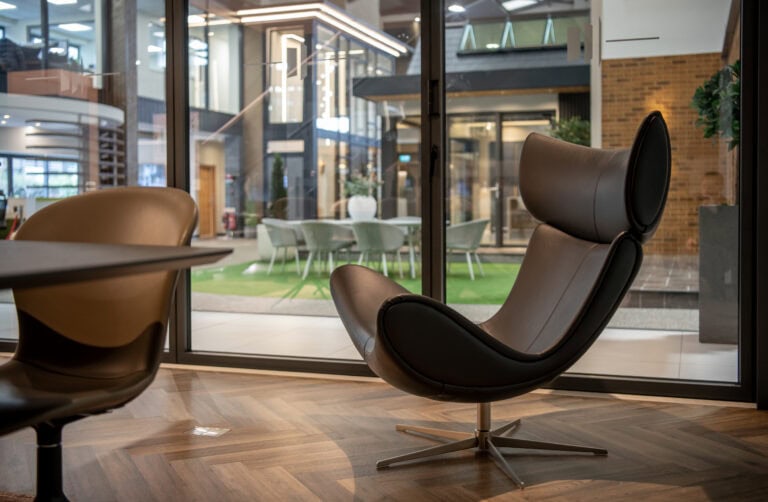 Elegant bi-folding doors opening to a modern Leeds showroom, showcasing stylish interior design and seamless indoor-outdoor transition solutions. Perfect for enhancing home aesthetics.